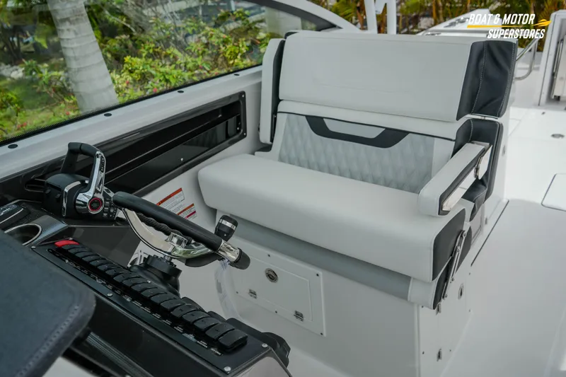 Slide: The Image of 2026 Blackfin 272 DC boat interior with modern helm and comfortable seating. - 41