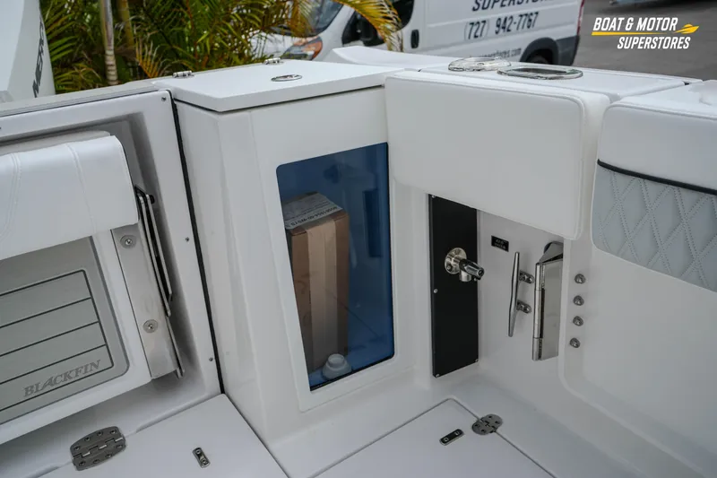Slide: The Image of Interior view of 2026 Blackfin 272 DC boat, showcasing storage compartments and sleek design. - 47