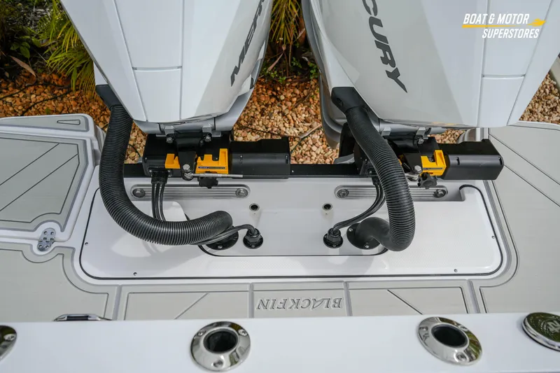 Slide: The Image of Twin Mercury outboard engines on a 2026 Blackfin 272 DC boat, showcasing advanced marine technology. - 50