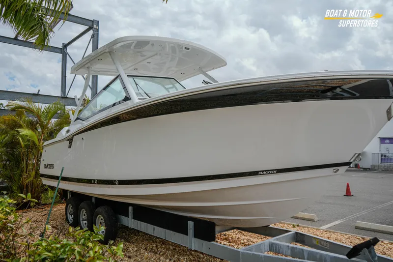 Slide: The Image of 2026 Blackfin 272 DC boat displayed outdoors on a trailer. - 6