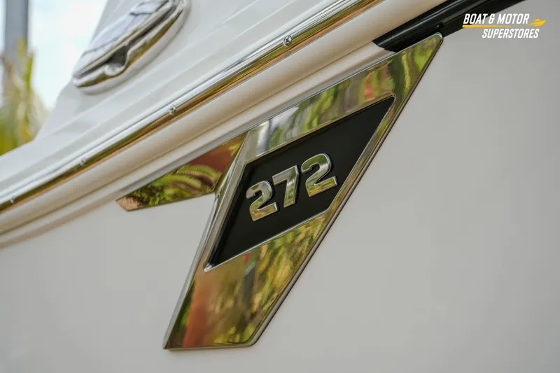 Slide: The Image of Close-up of 2026 Blackfin 272 DC boat emblem with chrome detailing. - 7