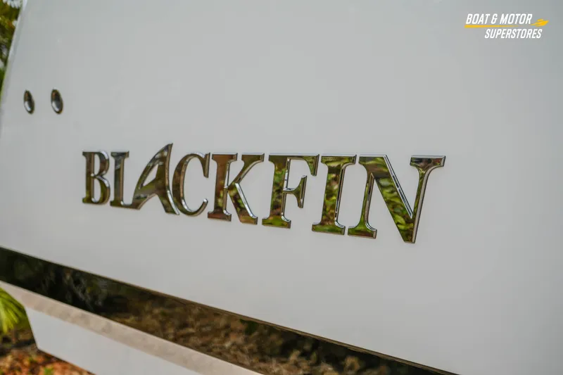 Slide: The Image of Close-up of 2026 Blackfin 272 DC boat logo on white surface. - 8
