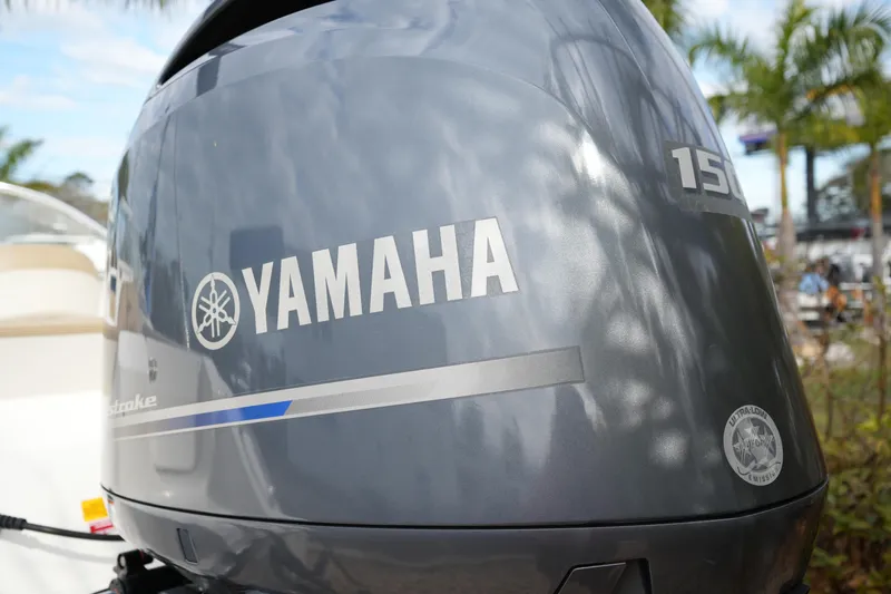 Slide: The Image of Yamaha 150 outboard motor on 2020 Key West 203 DFS boat, palm trees in background. - 12