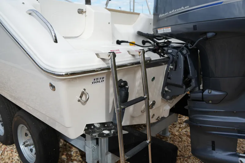 Slide: The Image of 2020 Key West 203 DFS boat with ladder and outboard motor detail. - 14