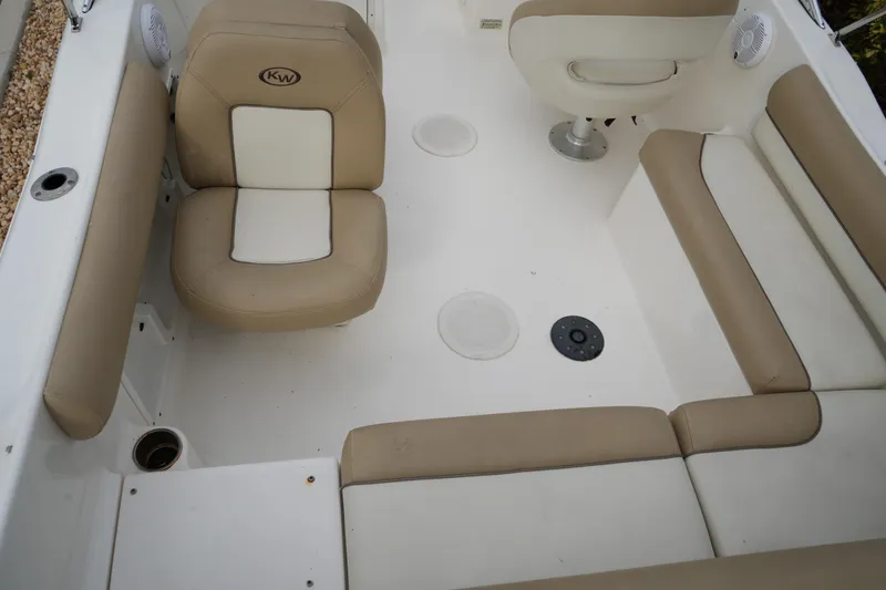 Slide: The Image of 2020 Key West 203 DFS boat interior with beige and white seating. - 15