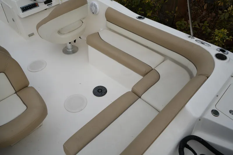Slide: The Image of Interior seating of 2020 Key West 203 DFS boat with beige and white upholstery. - 18