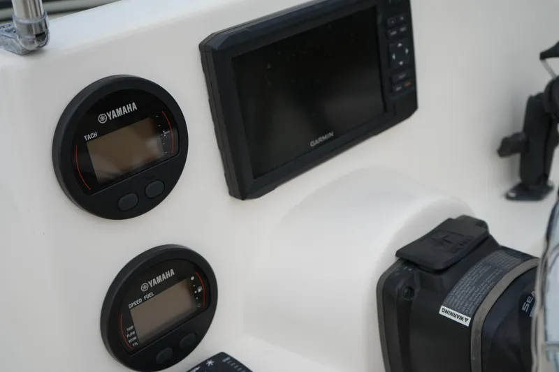 Slide: The Image of Dashboard of 2020 Key West 203 DFS boat with Yamaha gauges and Garmin display. - 25