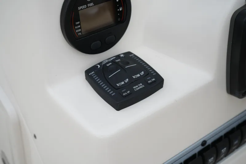 Slide: The Image of Control panel of 2020 Key West 203 DFS boat with speed and trim tab indicators. - 26