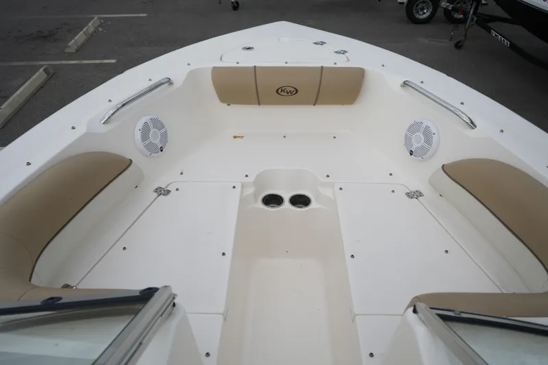 Slide: The Image of 2020 Key West 203 DFS boat interior with beige seating and speakers. - 31