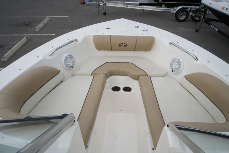 Slide: The Image of Bow seating area of 2020 Key West 203 DFS boat with beige cushions. - 39