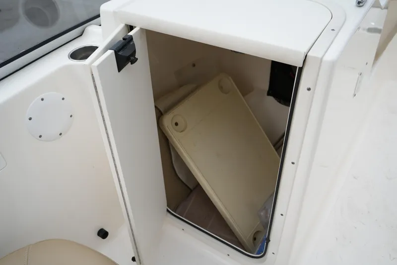 Slide: The Image of Open storage compartment on a 2020 Key West 203 DFS boat, showing interior space. - 42