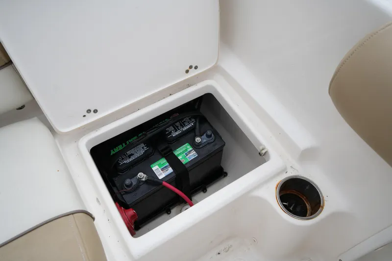 Slide: The Image of Battery compartment of 2020 Key West 203 DFS boat, featuring dual marine batteries. - 46