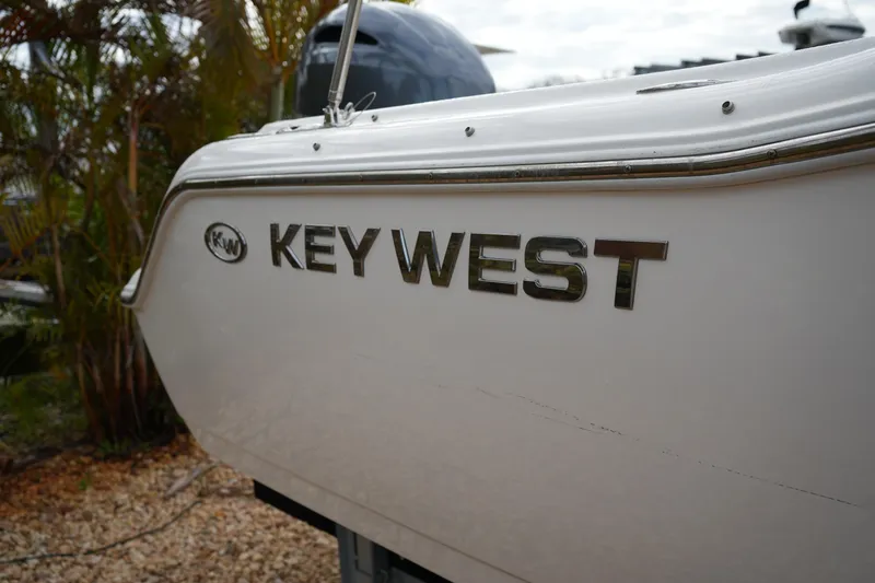 Slide: The Image of 2020 Key West 203 DFS boat side view with logo and sleek design. - 9
