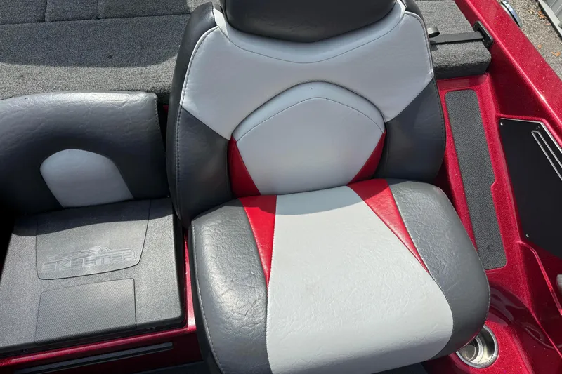 Slide: The Image of 2017 Skeeter ZX250 boat seat with red, gray, and white upholstery. - 12