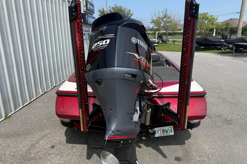 Slide: The Image of 2017 Skeeter ZX250 boat with Yamaha 250 outboard motor, parked outdoors. - 4