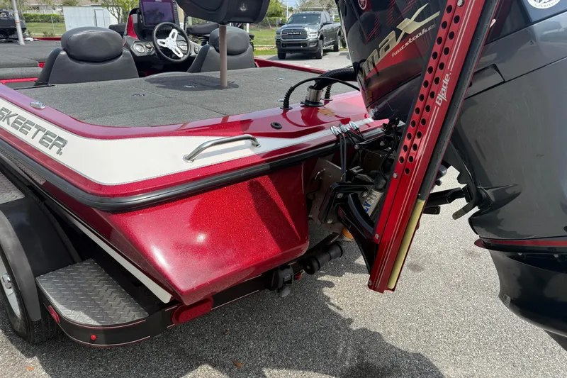 Slide: The Image of 2017 Skeeter ZX250 boat with red finish and Yamaha outboard motor. - 5
