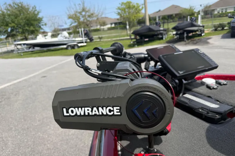 Slide: The Image of Lowrance navigation system on a 2017 Skeeter ZX250 boat, parked outdoors. - 8