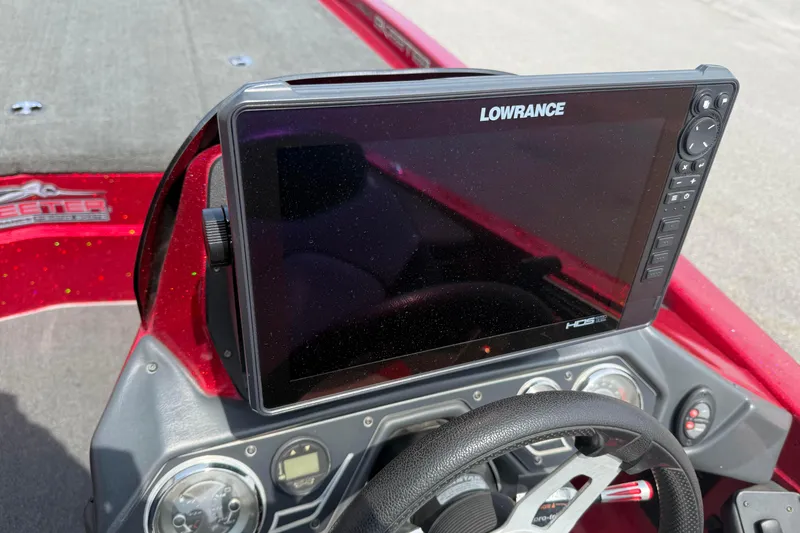 Slide: The Image of 2017 Skeeter ZX250 boat dashboard with Lowrance HDS display and steering wheel. - 9