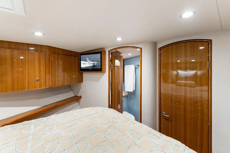 Slide: The Image of Luxurious interior of 2018 Viking 44 Express yacht with wood finishes and modern amenities. - 102