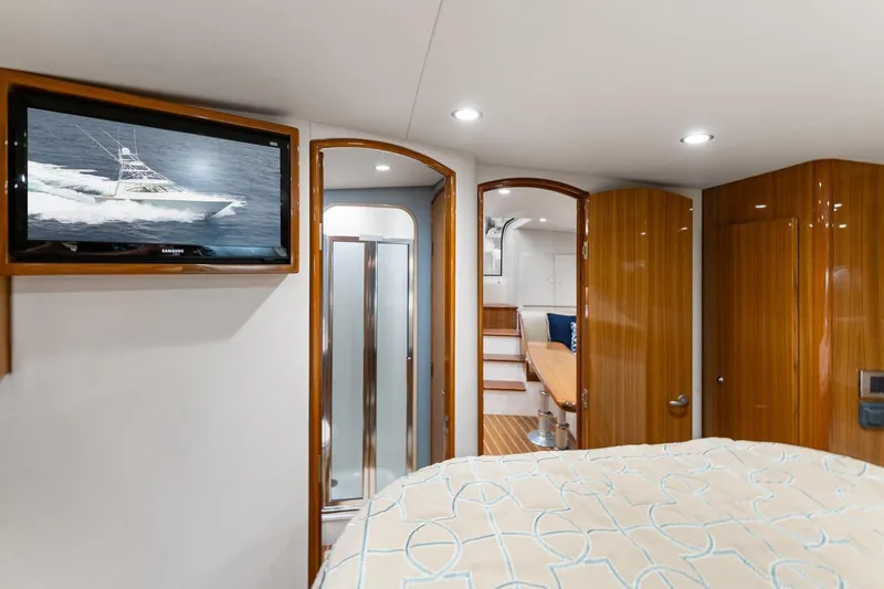 Slide: The Image of Luxurious interior of 2018 Viking 44 Express yacht with wood finishes and modern amenities. - 103