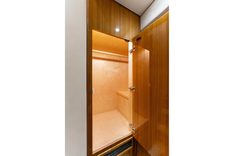 Slide: The Image of Wooden interior storage space on a 2018 Viking 44 Express yacht. - 110