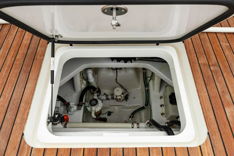 Slide: The Image of Open hatch on 2018 Viking 44 Express yacht, revealing mechanical components. - 116
