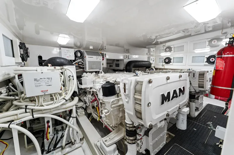 Slide: The Image of Engine room of 2018 Viking 44 Open yacht with MAN engines and fire extinguisher. - 109