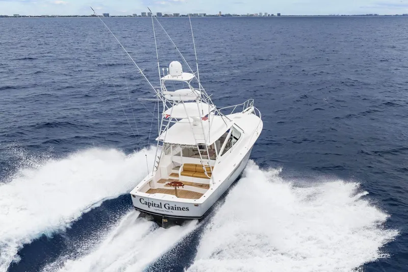 Slide: The Image of 2018 Viking 44 Express yacht cruising on open ocean waters. - 17