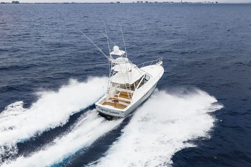 Slide: The Image of 2018 Viking 44 Express yacht cruising swiftly on open ocean waters. - 18