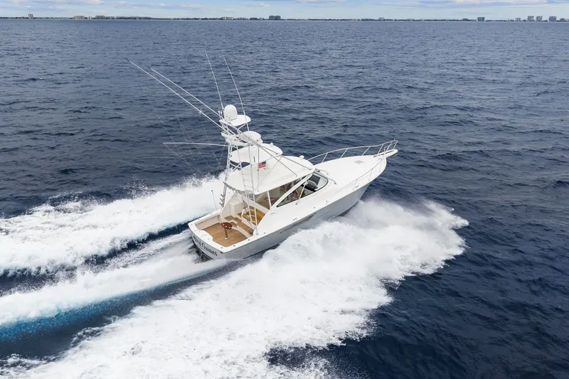 Slide: The Image of 2018 Viking 44 Express yacht cruising swiftly on open ocean waters. - 19