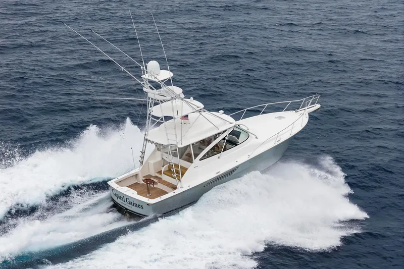 Slide: The Image of 2018 Viking 44 Express yacht cruising on open ocean waters. - 20