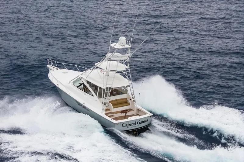Slide: The Image of 2018 Viking 44 Express yacht navigating ocean waves. - 25