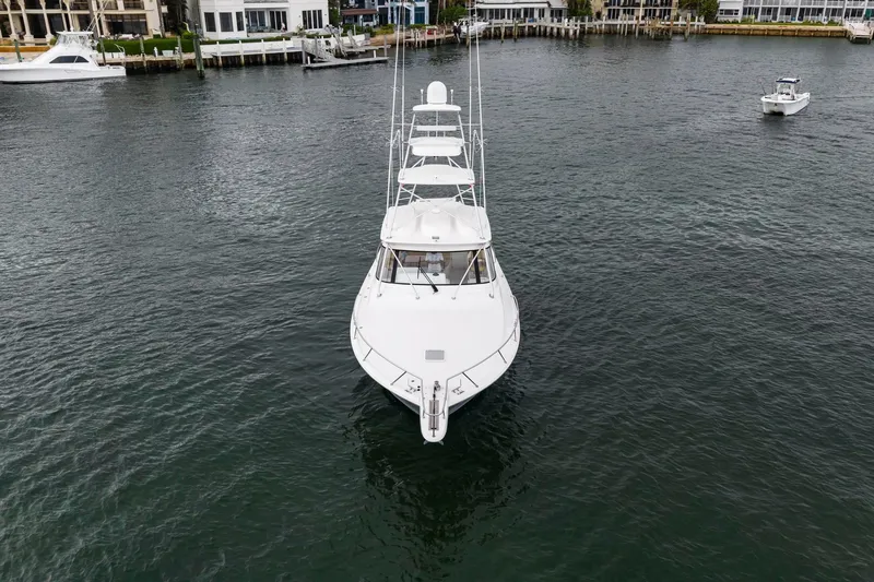 Slide: The Image of 2018 Viking 44 Express yacht on calm water, front view. - 33