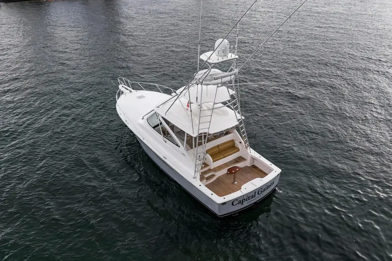 Slide: The Image of 2018 Viking 44 Express yacht on open water, aerial view. - 35
