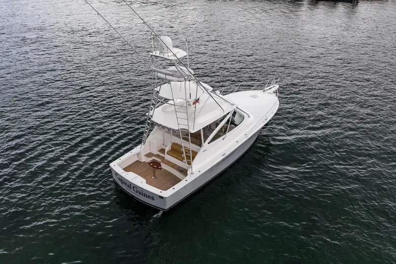 Slide: The Image of 2018 Viking 44 Express yacht on open water, showcasing sleek design and spacious deck. - 37