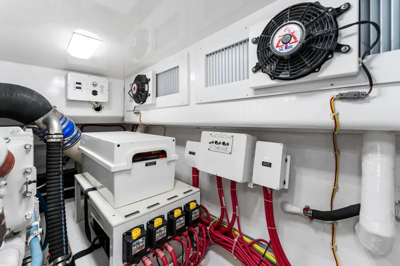 Slide: The Image of Engine room of 2018 Viking 44 Open yacht with electrical components and ventilation system. - 98