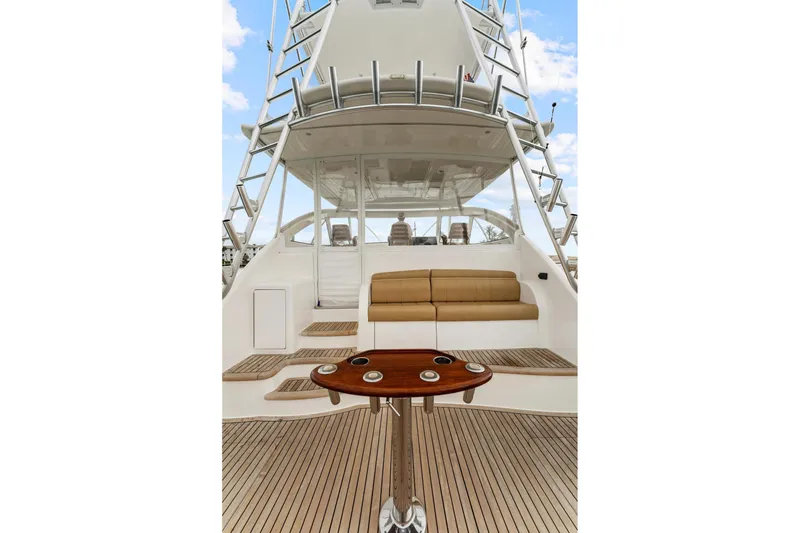 Slide: The Image of 2018 Viking 44 Express yacht deck with seating and table, showcasing luxury design. - 48
