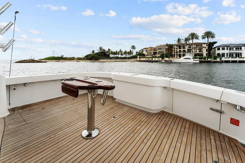 Slide: The Image of 2018 Viking 44 Express yacht deck with scenic waterfront view. - 50