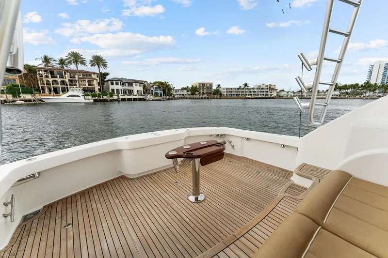 Slide: The Image of 2018 Viking 44 Express yacht deck with waterfront view and luxurious seating. - 52