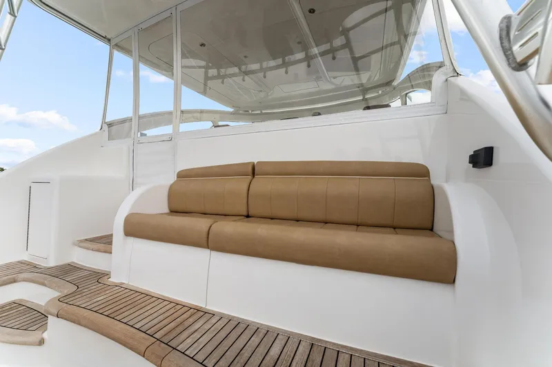 Slide: The Image of 2018 Viking 44 Express yacht with tan seating and teak flooring. - 55