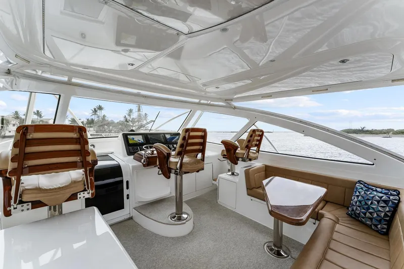 Slide: The Image of Luxurious interior of 2018 Viking 44 Express yacht with plush seating and helm station. - 61