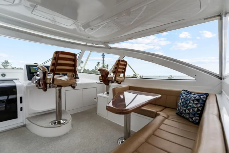 Slide: The Image of Luxurious interior of 2018 Viking 44 Express yacht with helm chairs and seating area. - 62
