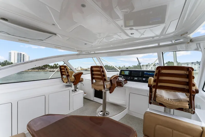 Slide: The Image of Luxurious interior of 2018 Viking 44 Express yacht with leather seating and modern controls. - 66