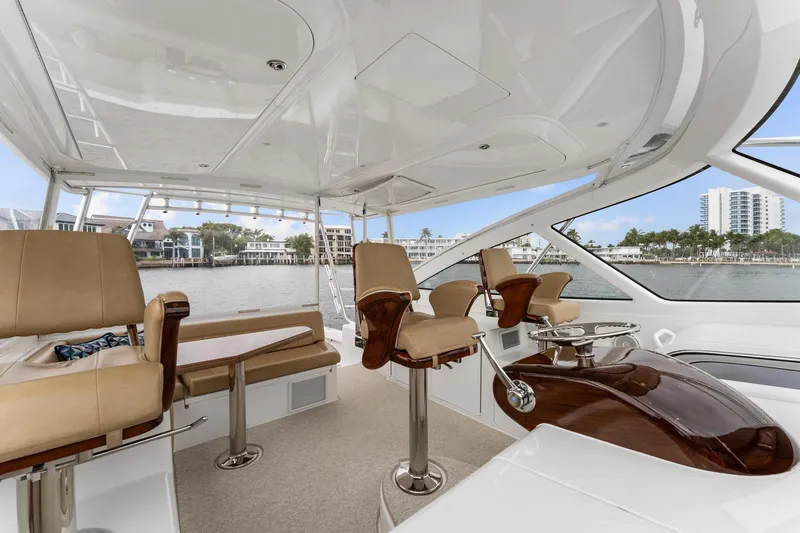 Slide: The Image of 2018 Viking 44 Express yacht interior with luxurious seating and waterfront view. - 72