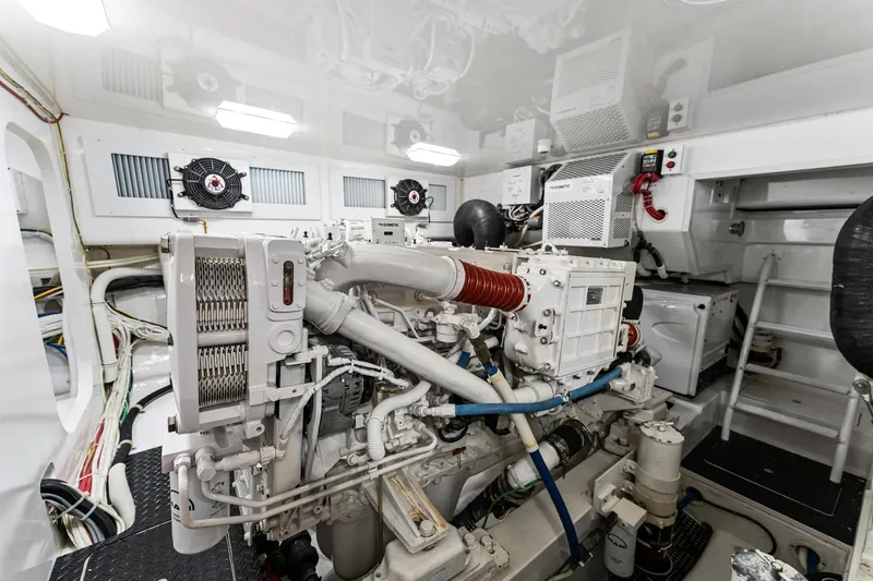 Slide: The Image of Engine room of 2018 Viking 44 Open yacht, showcasing complex machinery and equipment. - 99