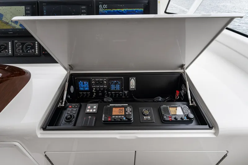 Slide: The Image of Control panel of 2018 Viking 44 Express yacht with navigation and communication equipment. - 78