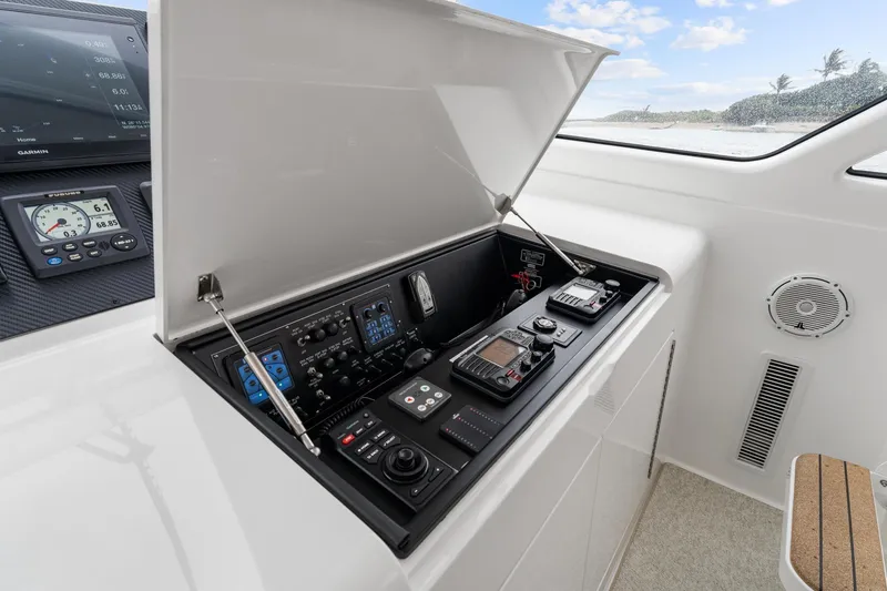 Slide: The Image of 2018 Viking 44 Express yacht control panel with advanced navigation instruments. - 80