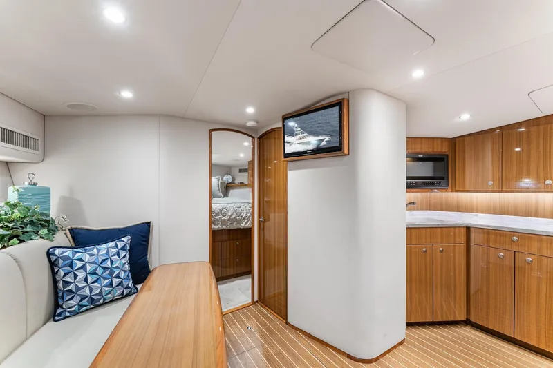 Slide: The Image of Luxurious interior of 2018 Viking 44 Express yacht with modern kitchen and cozy seating area. - 82
