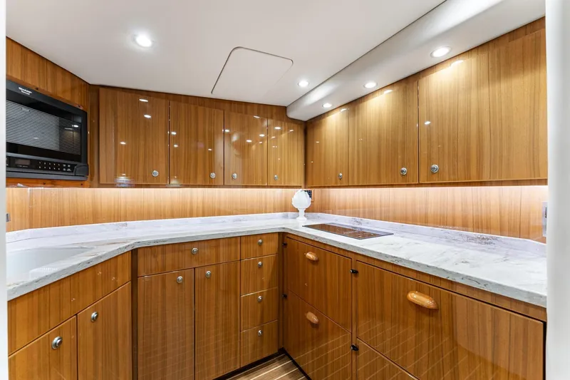 Slide: The Image of Luxurious wooden kitchen interior of 2018 Viking 44 Express yacht with modern appliances. - 86