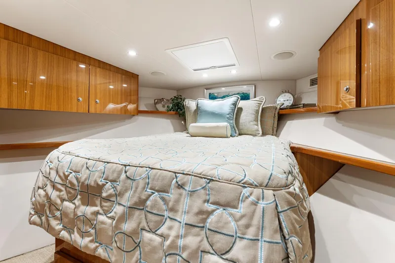 Slide: The Image of Luxurious cabin interior of 2018 Viking 44 Express yacht with elegant bedding and wood cabinetry. - 89